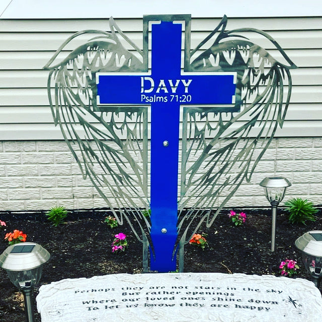 In Memory of Metal Wings Wrapping Around A Cross